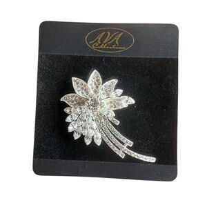 New- Ava collection rhinestone brooch in silver tone.